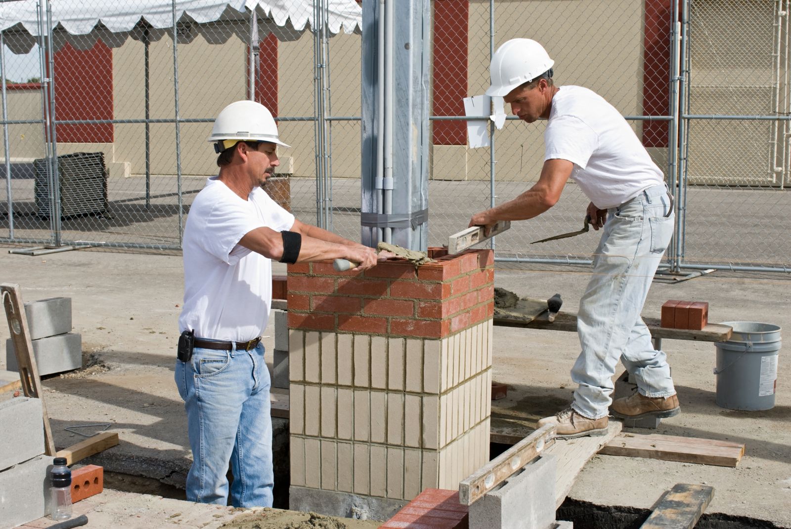 Freshly tuckpointed brick wall on a Chicago two-flat, joints tooled flat and even